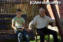 [P02] 4 generations: Ioana's grandson on the swing seat in the garden with his great-grandfather. Taken on Aug. 14, 2011 » foto by Matthias
 - 
<span class="allrVoted glyphicon glyphicon-heart hidden" id="av297444"></span>
<a class="m-l-10 hidden" id="sv297444" onclick="voting_Foto_DelVot(,297444,9142)" role="button">șterge vot <span class="glyphicon glyphicon-remove"></span></a>
<a id="v9297444" class=" c-red"  onclick="voting_Foto_SetVot(297444)" role="button"><span class="glyphicon glyphicon-heart-empty"></span> <b>LIKE</b> = Votează poza</a> <img class="hidden"  id="f297444W9" src="/imagini/loader.gif" border="0" /><span class="AjErrMes hidden" id="e297444ErM"></span>